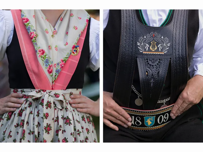 Detailaufnahme der Südtiroler Tracht mit floralem Halstuch und schwarzem Ledergürtel